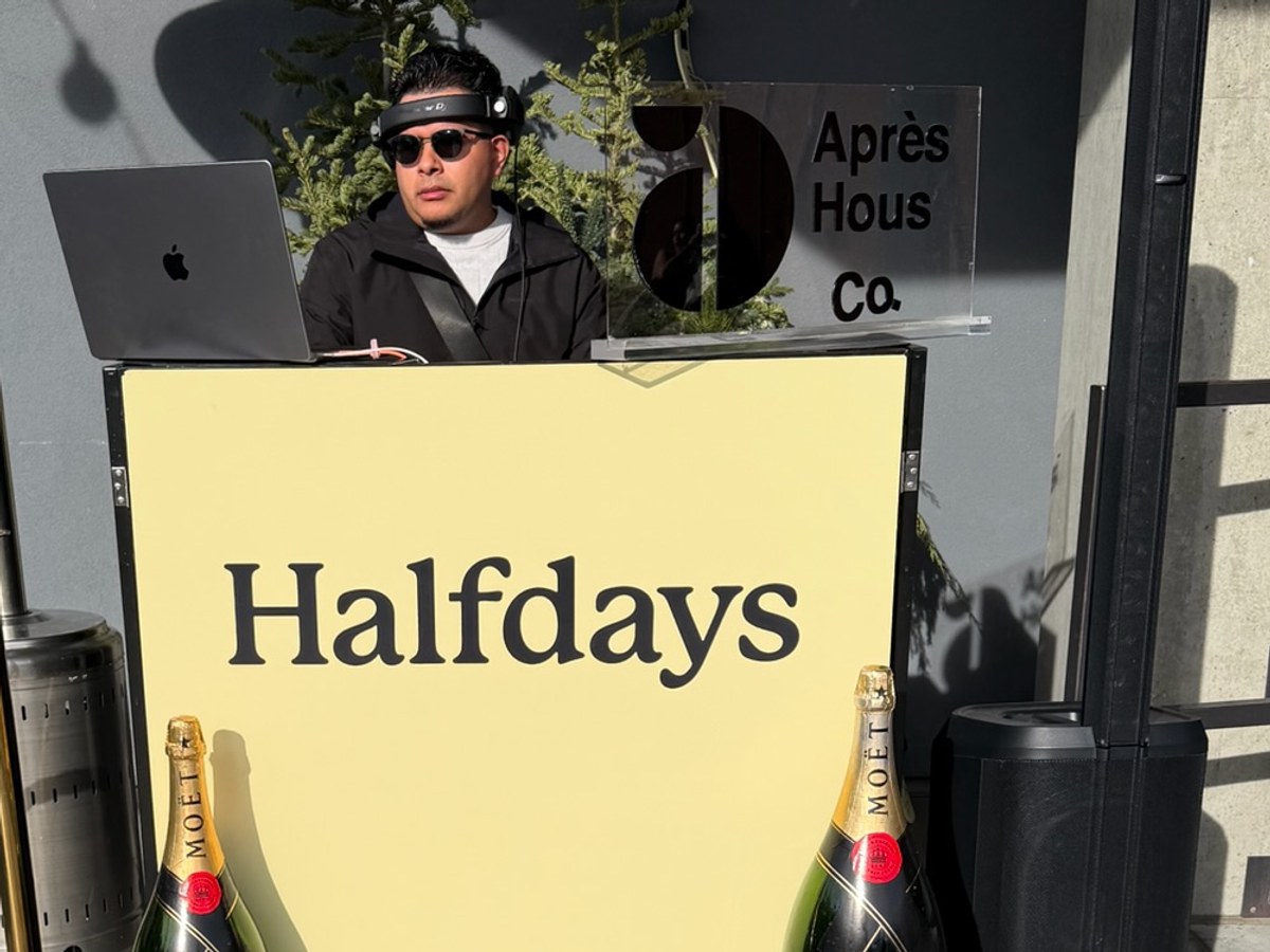 Halfdays branded DJ booth with Moet magnums at an Apres House activation
